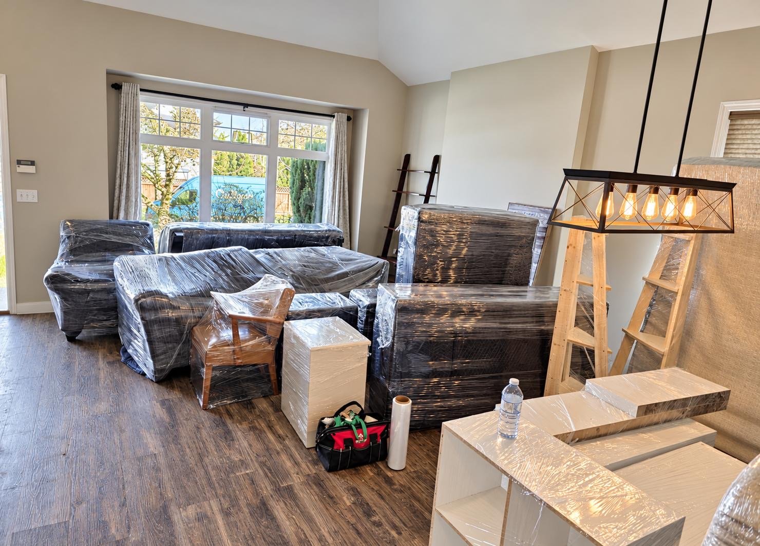 Wrapped furniture placed in a room